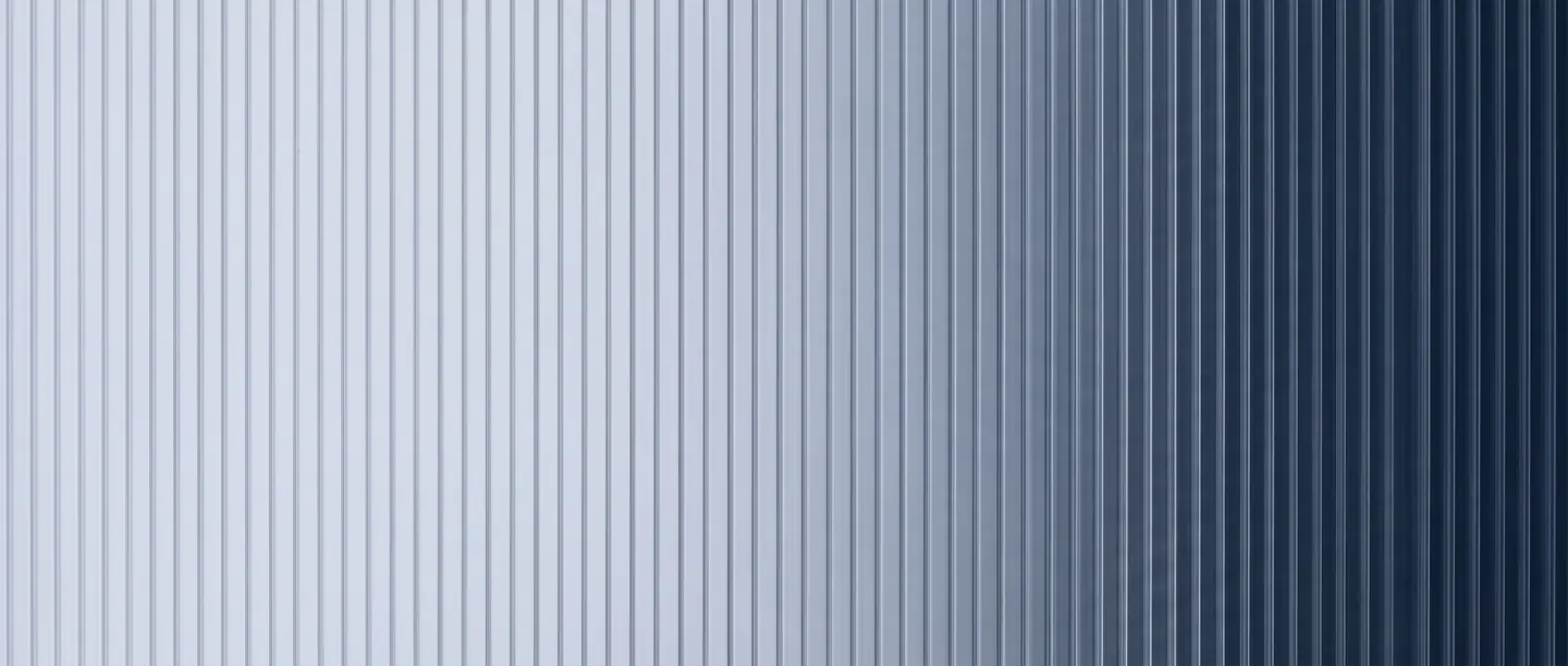 Twin-wall polypropylene sheet seen close up, its parallel ribs running the full height of the panel.