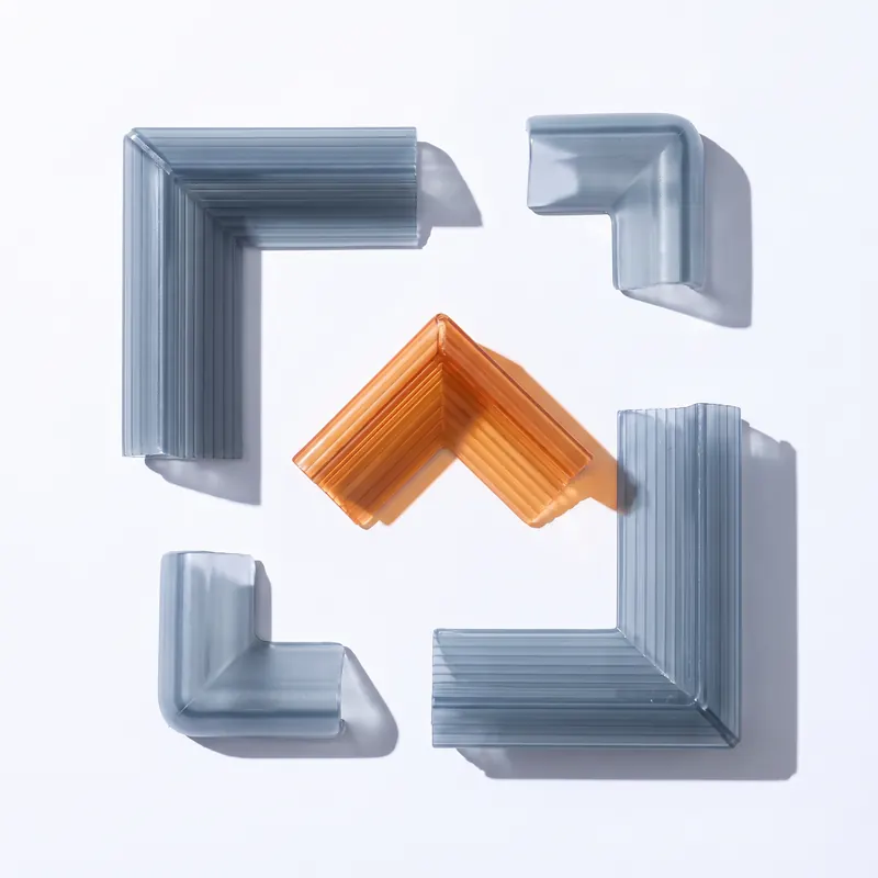 Twin-wall polypropylene edge and corner protectors in grey-blue, with one orange corner piece among them.